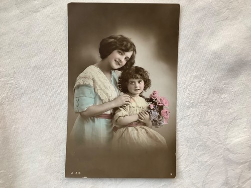 Lady holding shoulder girl - of,