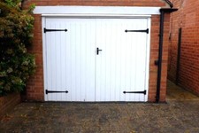 Pair of Solid Wooden Garage Doors with Ornamental Side Hinges
