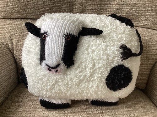 Hand knitted cow - hand,