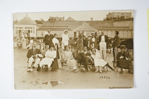 Holidaymakers beach deckchairs - holidaymakers,