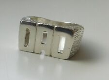 A SOLID SILVER DAD RING