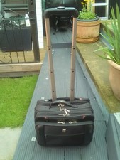 SWISSGEAR BY WENGER LUGGAGE BAG WITH WHEELS & EXTENDABLE HANDLE - CONDITION OK .