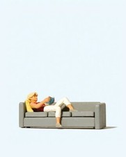 Woman Reading on Sofa Figure