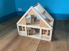 PLAN TOYS WOODEN DOLLS HOUSE AND SOME FURNITURE