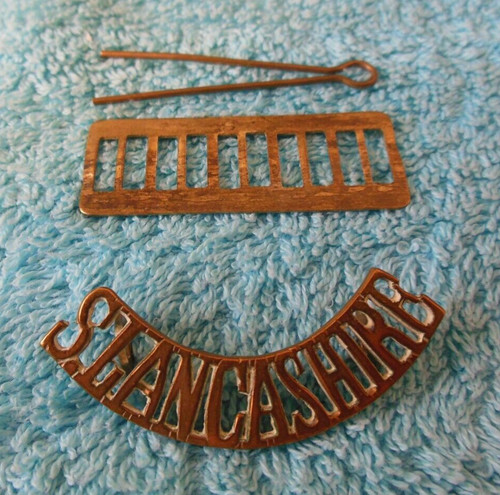 Old brass shoulder title south - old,