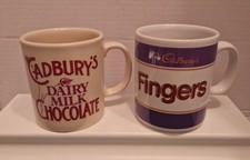 Cadbury Mugs X2. Dairy Milk & Fingers. Good Pre-owned Condition.