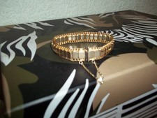 UNUSUAL ROLLED GOLD BRACELET