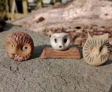 trio of ceramic owl sculptures