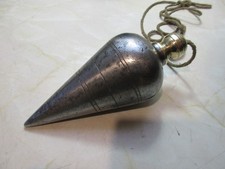 Rare extra large plumb bob, iron and brass with a steel tip, 6" long x 2 1/2".