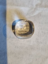 Small Message Writen On The Base Of A Tiny Magnifying Glass