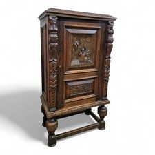 Antique heavily carved bulbous oak storage linen cupboard / side cabinet