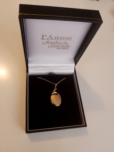 9ct gold oval locket - &,