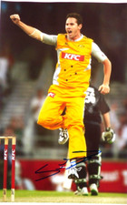 SHAUN TAIT AUSTRALIA CRICKET, AUTOGRAPHED A4 PHOTOGRAPH.