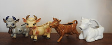 A collection of 4 Cow Creamers. Very Good Condition