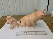 Two Beswick Sows with piglets