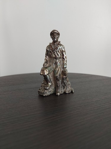Pewter statue man sitting - of,