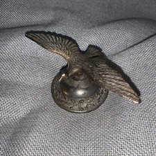 Vintage brass bird mascot car