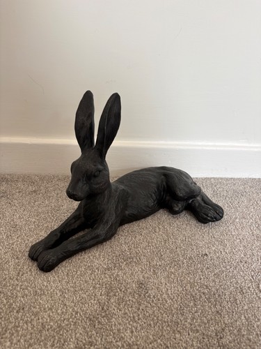 Large black lying hare - black,