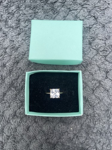 Gold solitaire ring with