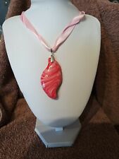 This pendant in multipool shades of pink will enhance any outfit