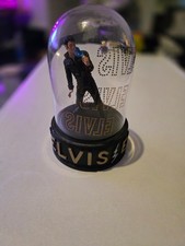 elvis figurine in glass case