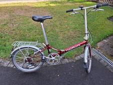 Ridgeback impulse folding bicycle in great condition and painted in metallic red