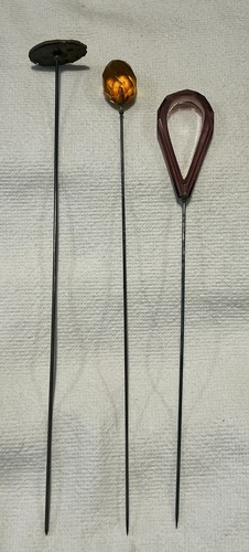 Three antique hat pins - three,