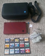 Nintendo DSI XL Wine Red . Includes 15 games and official memory card.