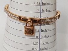 Michael Kors Lock and Crystal Gold Tone Hinged Bangle Bracelet
