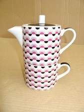 Tea pot and cup set   Porcelain teapot from Debenhams in pristine condition.