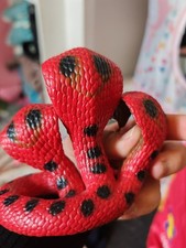 A toy, a snake figurine with 3