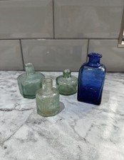 Three small antique green glass bottles and vintage cobalt blue
