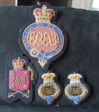 grenadier Guards a mixture of shoulder, arm and large bullion badges.