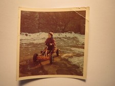 little boy with hat riding in