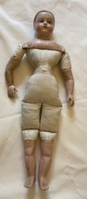ANTIQUE WAX OVER PAPER MACHE DOLL WITH A PERIOD GOWN TO BE BE FITTED FOR HER