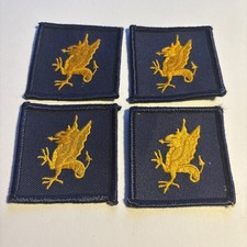 Military Badges. Four 43rd