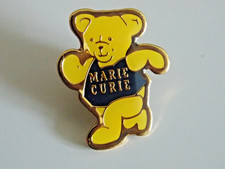 Marie Curie pin badge running