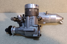 R/C model aircraft glow-plug engine, used.  OS MAX 25, inc. silencer.