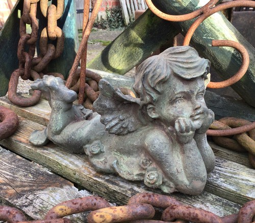 Metal cast iron cherub boy - cast,