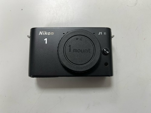 Nikon white mirrorless - j1,