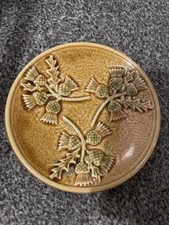 West Highland Pottery Co Ltd Plate. Ochre with Raised Thistle Pattern 16.5 cm