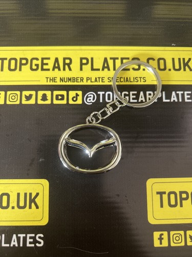 Mazda genuine badge - badge, key