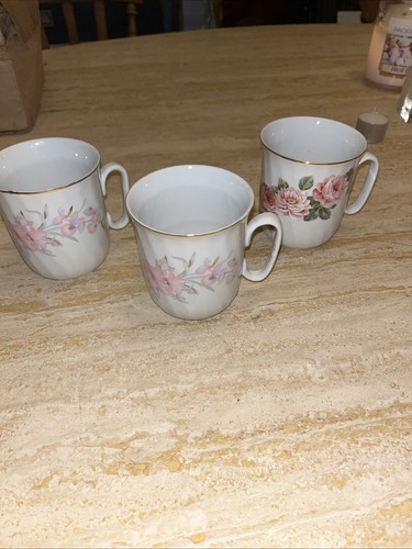 Three porcelain tea mugs - three,