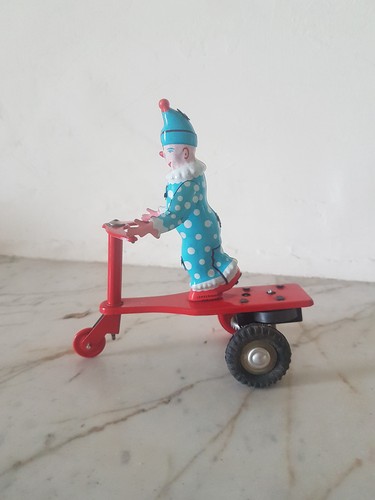 Tin wind toy clown - clown, on