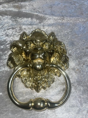 Lions head door knocker - lions,