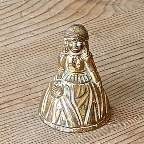 Very small brass lady - , bell
