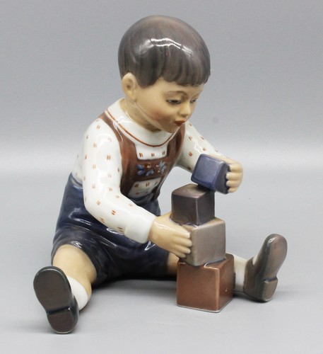 Porcelain figurine boy with - porcelain,