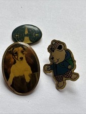 Three Mixed Metal Badges. 