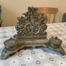 Ornate “cherubim” Brass