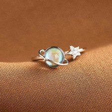Rotating star and moon ring to